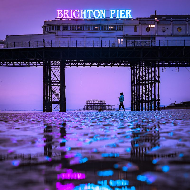 Brighton Pier Neon Lights at Low Tide