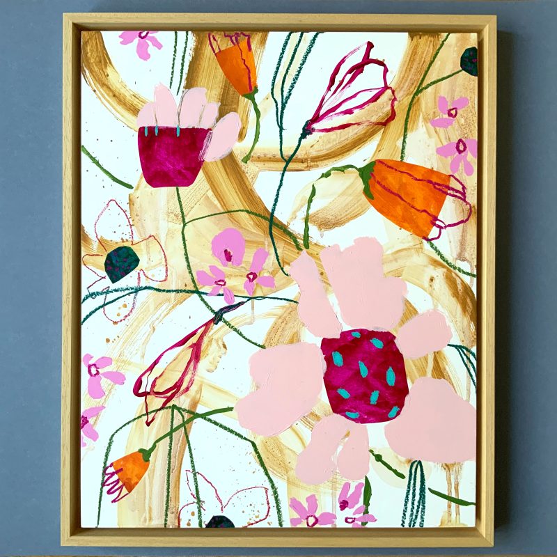 A colourful, vibrant playful floral painting in a neutral background with dashes of magenta, orange and turquoise. Framed in natural wood. 