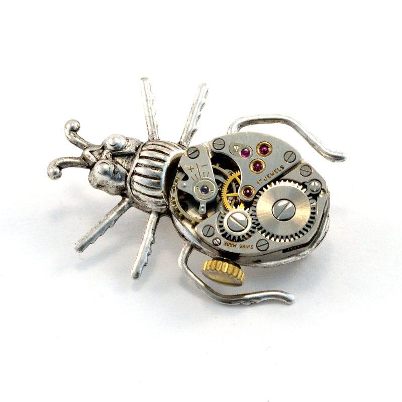 Silver beetle with a watch movement belly made into a brooch pin