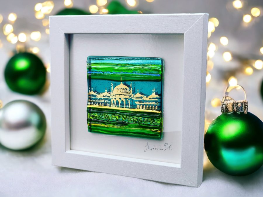 A textured glass tile in shades of green with an abstract image of Brighton Royal Pavilion in shiny 22ct gold