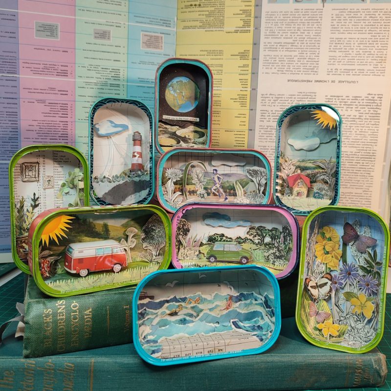 Selection of sardine tins with pretty dioramas inside 