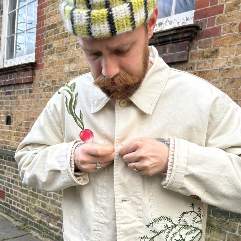 Male model wearing a bespoke, hand painted jacket