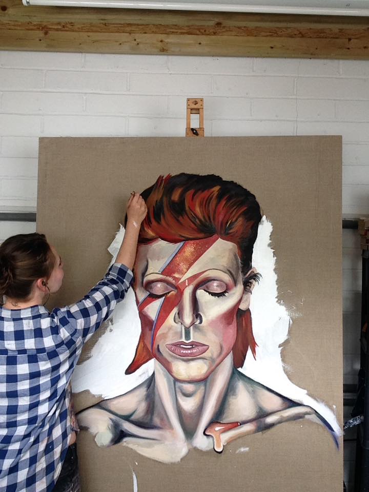 A picture of a the progress of a previous painting of David Bowie.