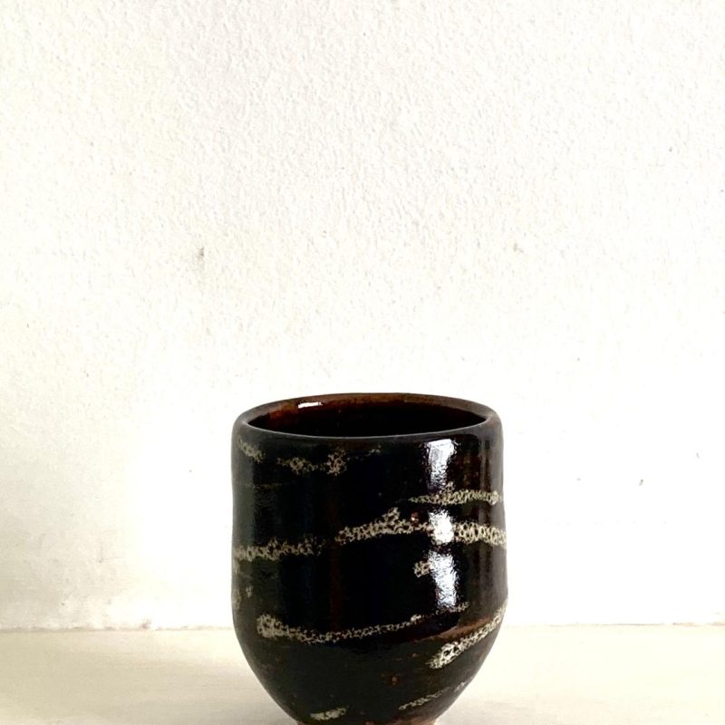 Hand thrown pottery - small cup, without a handle, glazed in tammoku (Japanese inspired brown ) and white dipped or dropped glaze, Perfect size for a small coffee or tea.