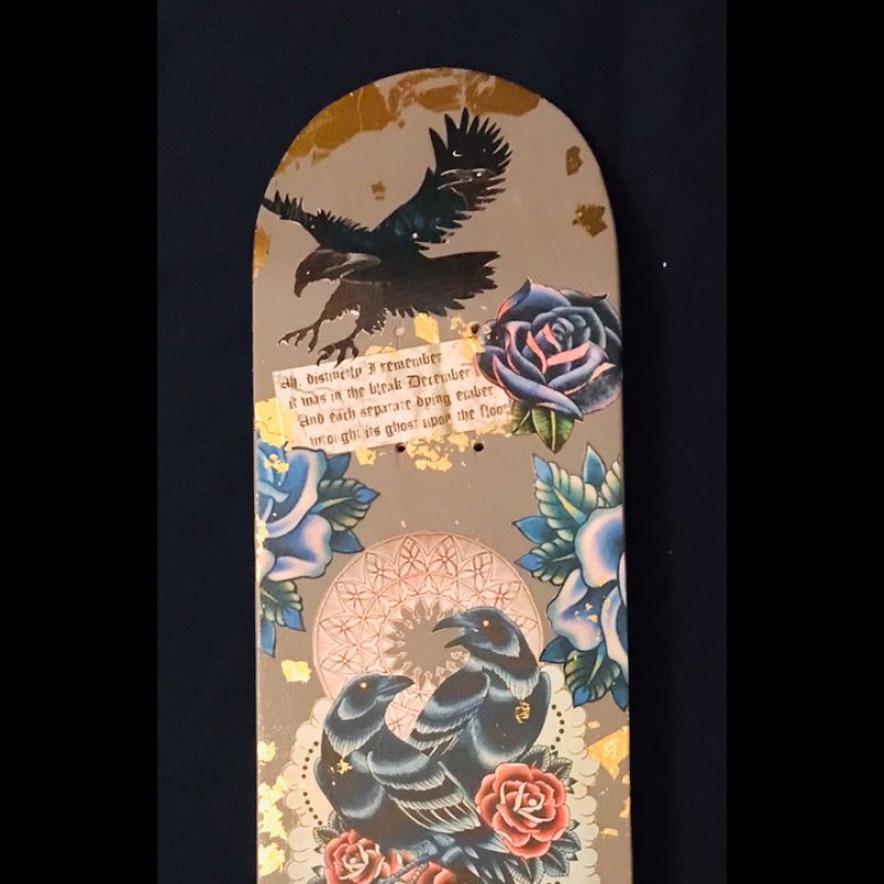 Decoupage skateboard using found images and gold gilding on a wooden board