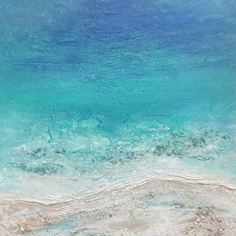 Abstract seascape aerial view with tranquil turquoise sea and chalky creamy shoreline.