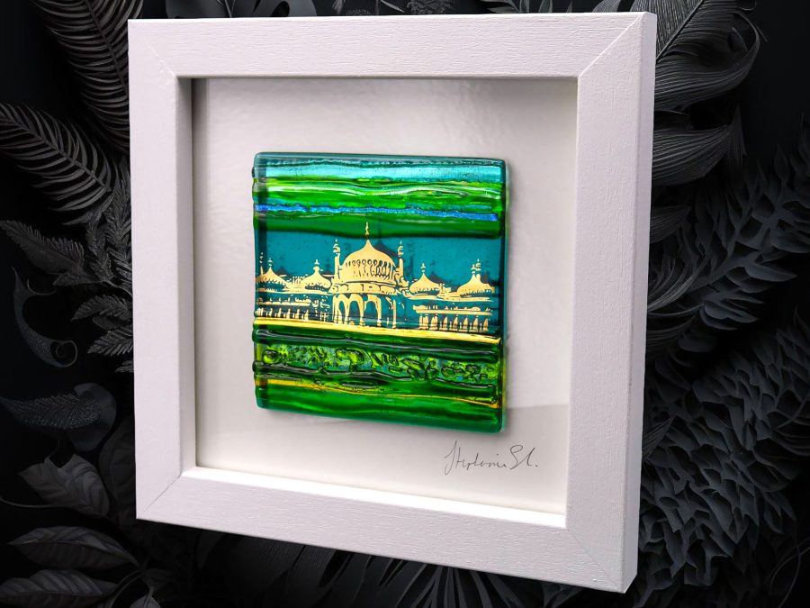 A textured glass tile in shades of green with an abstract image of Brighton Royal Pavilion in shiny 22 ct gold