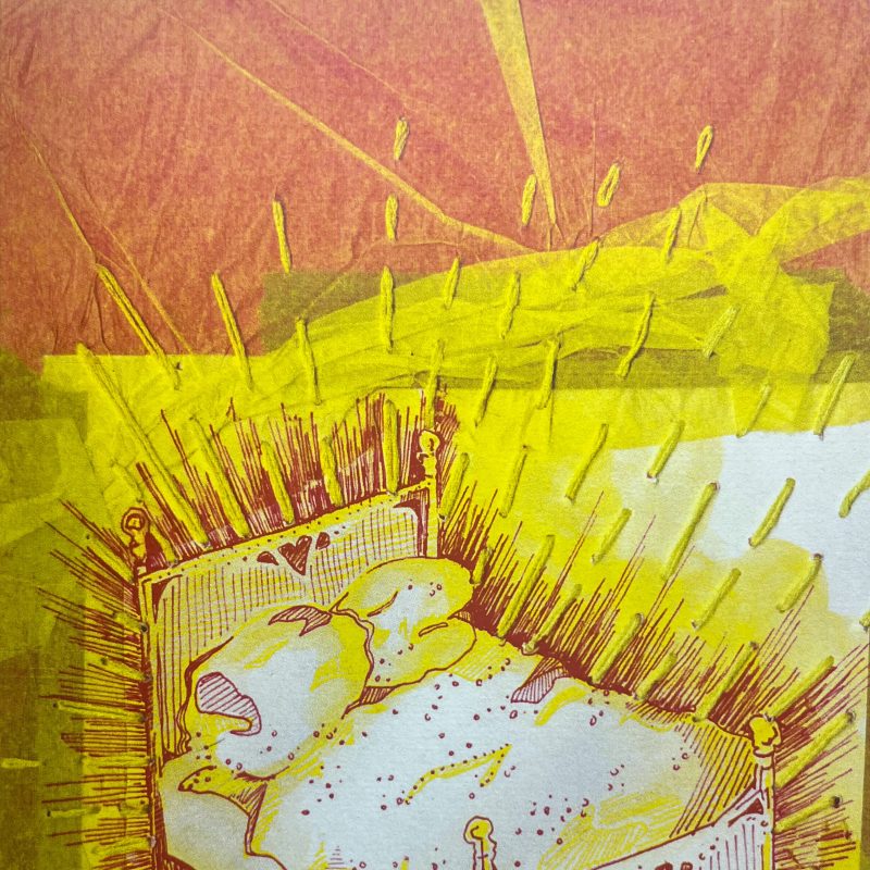 A bed lit with stitched sun rays. Yellow/orange and white colourways
