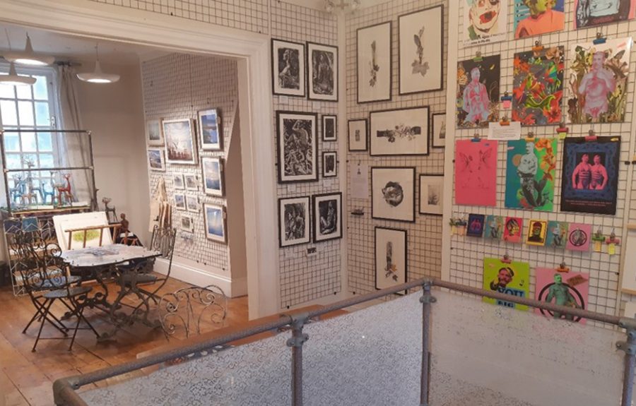 Art gallery with artworks displayed on the wall