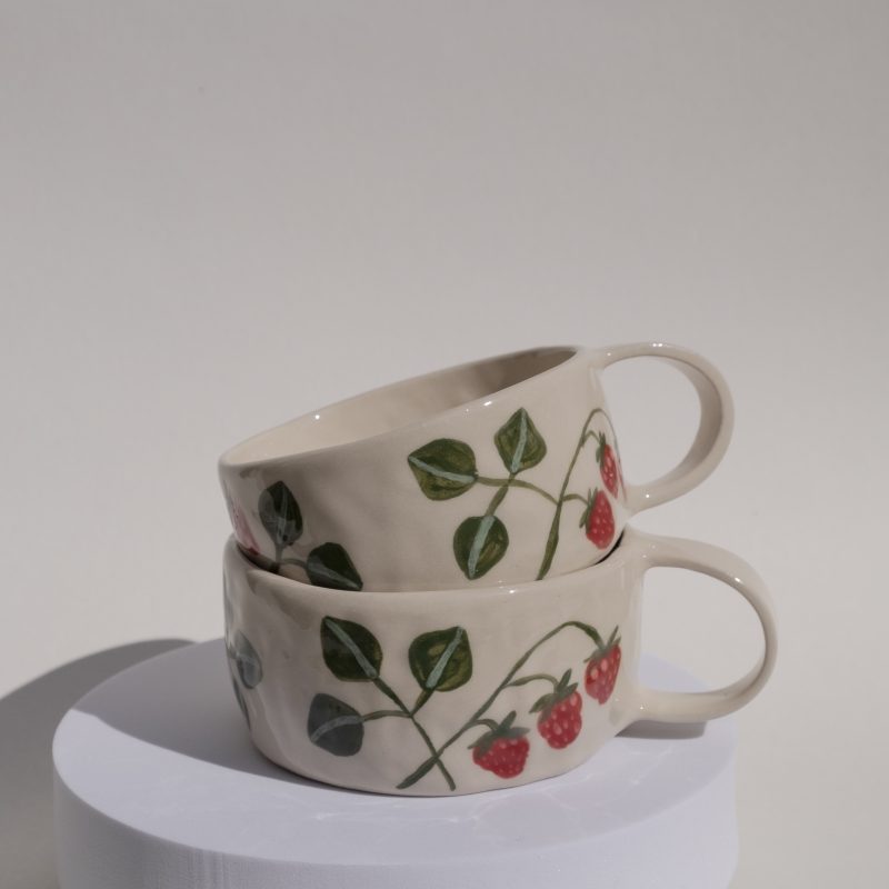 A set of pinch pot mugs with strawberry illustration