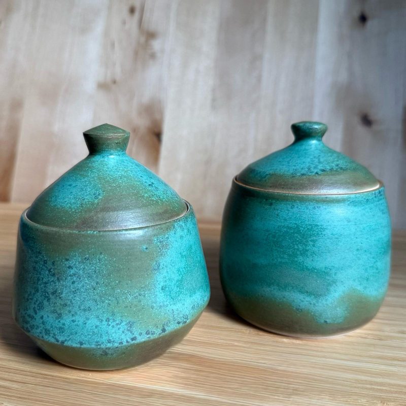 2 brightly coloured blue and grey ceramic pots with lids