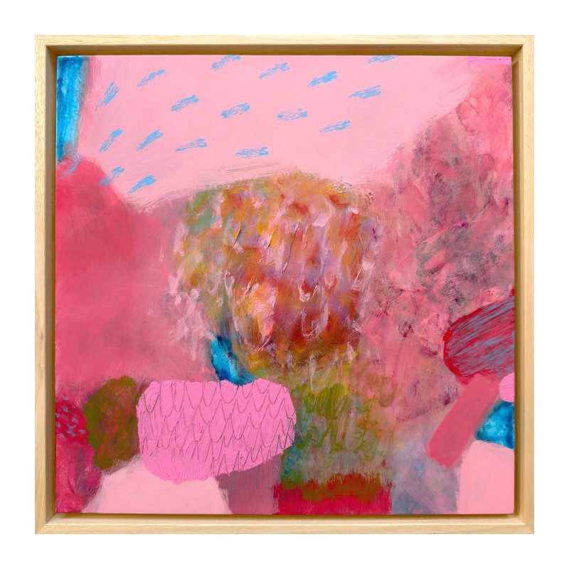 Square abstract painting in mostly pink hues with touches of cool blue and hot fiery orange. Framed in natural wood. 