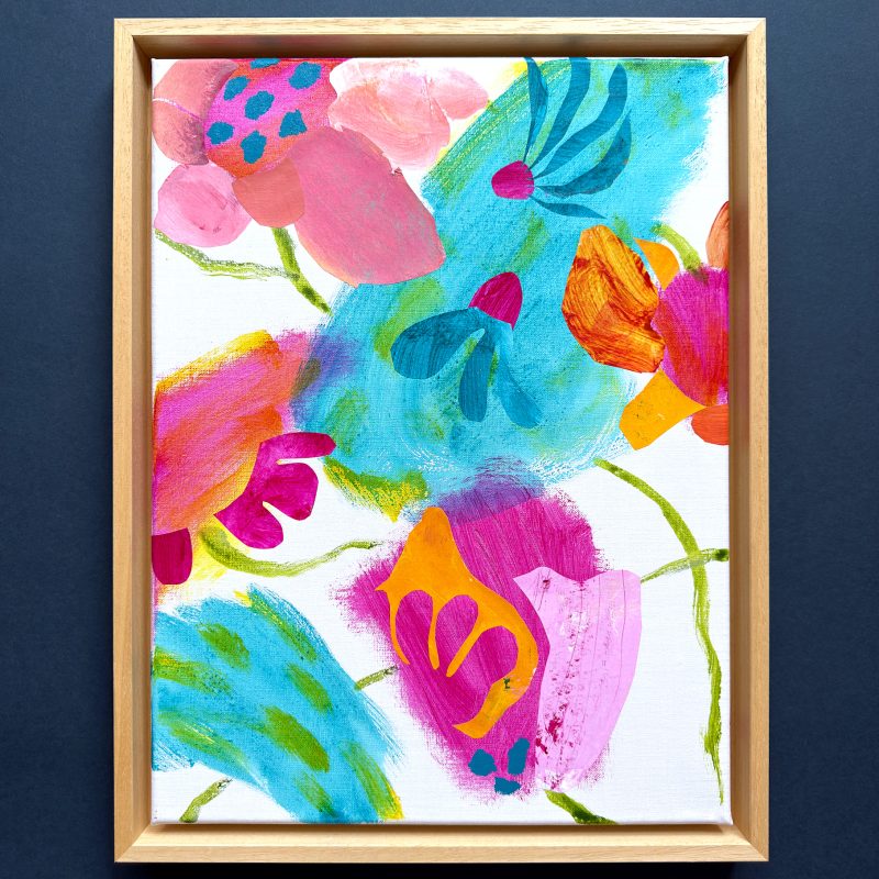 Playful colourful semi abstracted floral. Rectangular painting with white background and pink, magenta, orange and deep green floral forms with turquoise highlights. Framed in natural wood. 