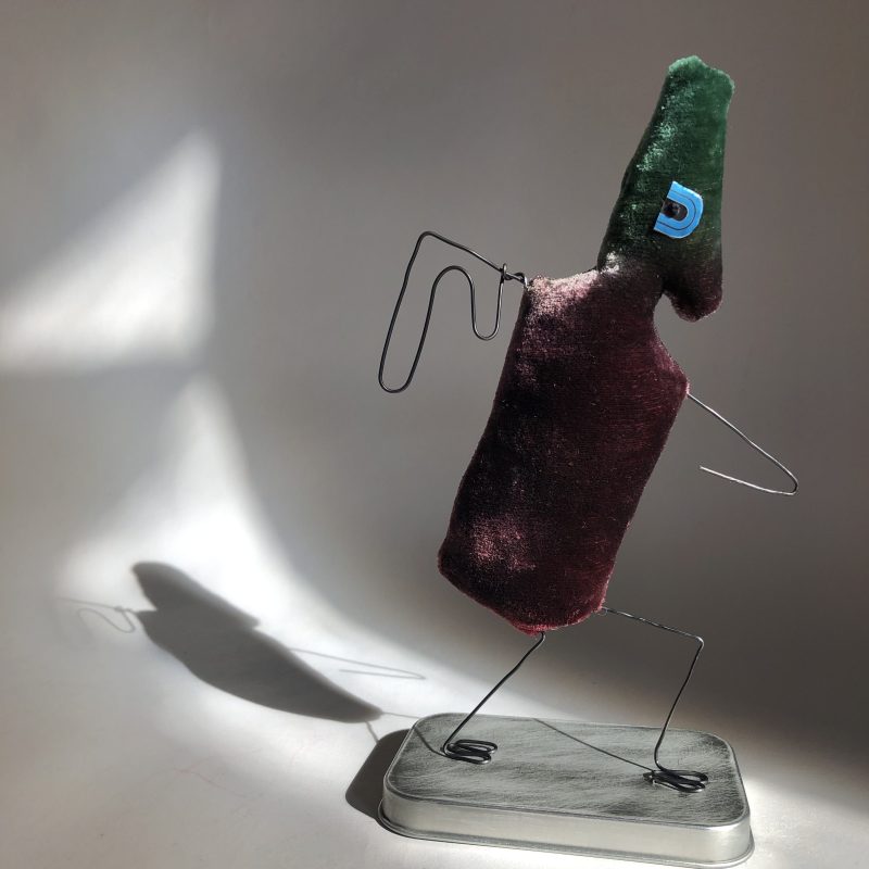 3D figure , with bird -like appearance, wire ‘wings’ and velvet body