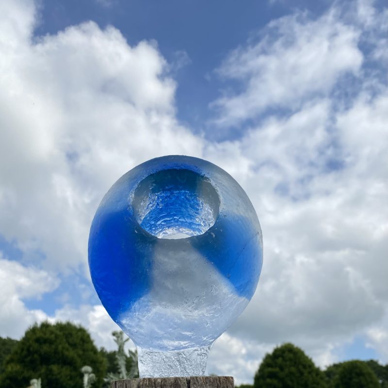 Oval Garden sculpture in blue and clear glass with viewing hole 