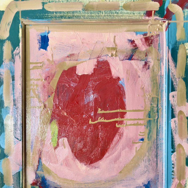 A red heart on a pale pink background.