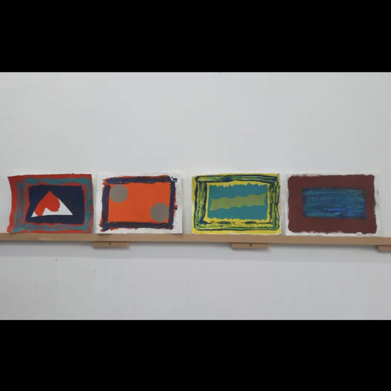 Image of small collages on shelf.