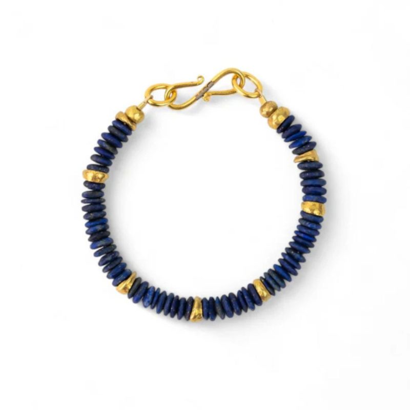 Bracelet made from discs of blue Lapis Lazuli and gold with a gold s-shaped clasp