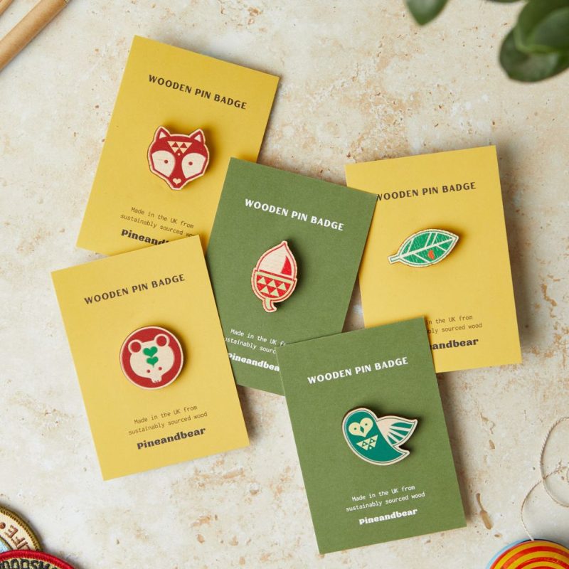 A selection of wooden pin badges