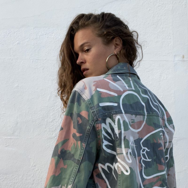 Camo denim jacket with painted illustration on the back 