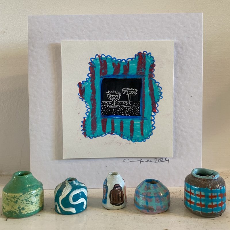 Hand painted card depicting a pot with pattern blue border, in the foreground miniature ceramic pots in blue colour ways 