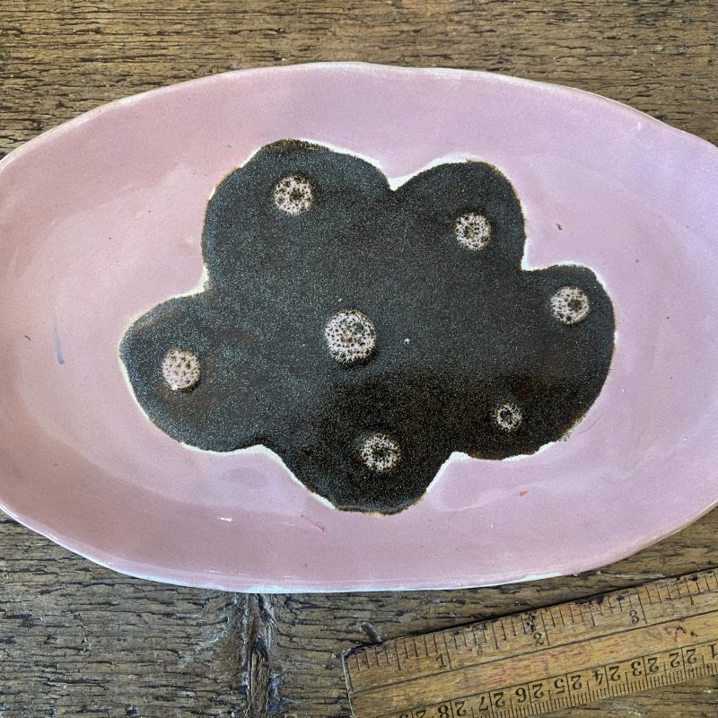 Pink ceramic hand made plate with dark grey flower motif