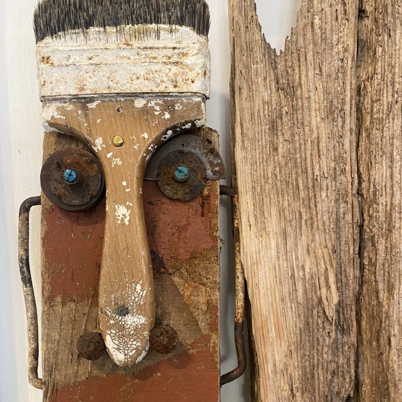 Figure constructed with salvaged materials; wood, paintbrush, iron mongery