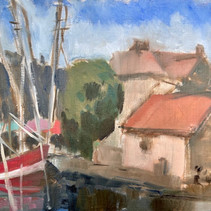 A harbour scene with red boats