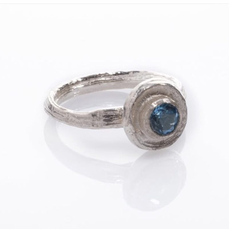 Blue topaz stoned ring made from silver cast from Angelica .