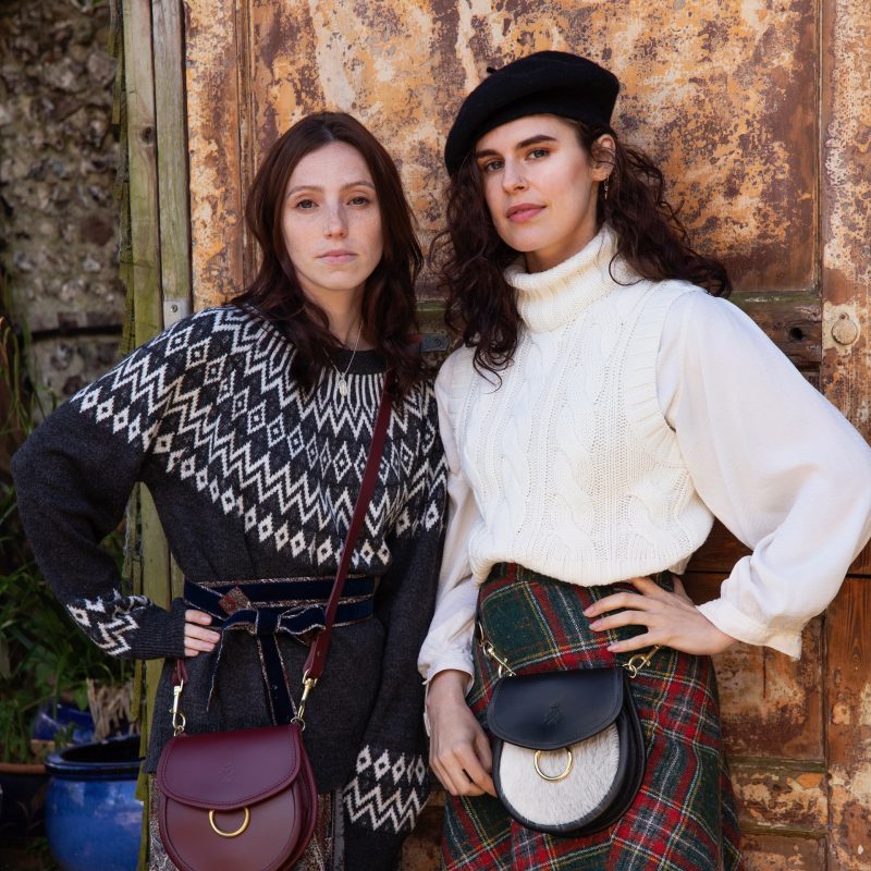 Ox Blood Cross-Body Saddle bag with Brass Hoop; Black Leather Beltbag with Cream Hair-On-Hide front panel Saddle bag with Brass Hoop