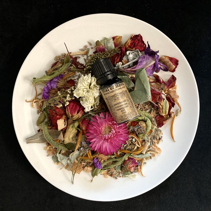 Essential oil bottle nestled in pot pour