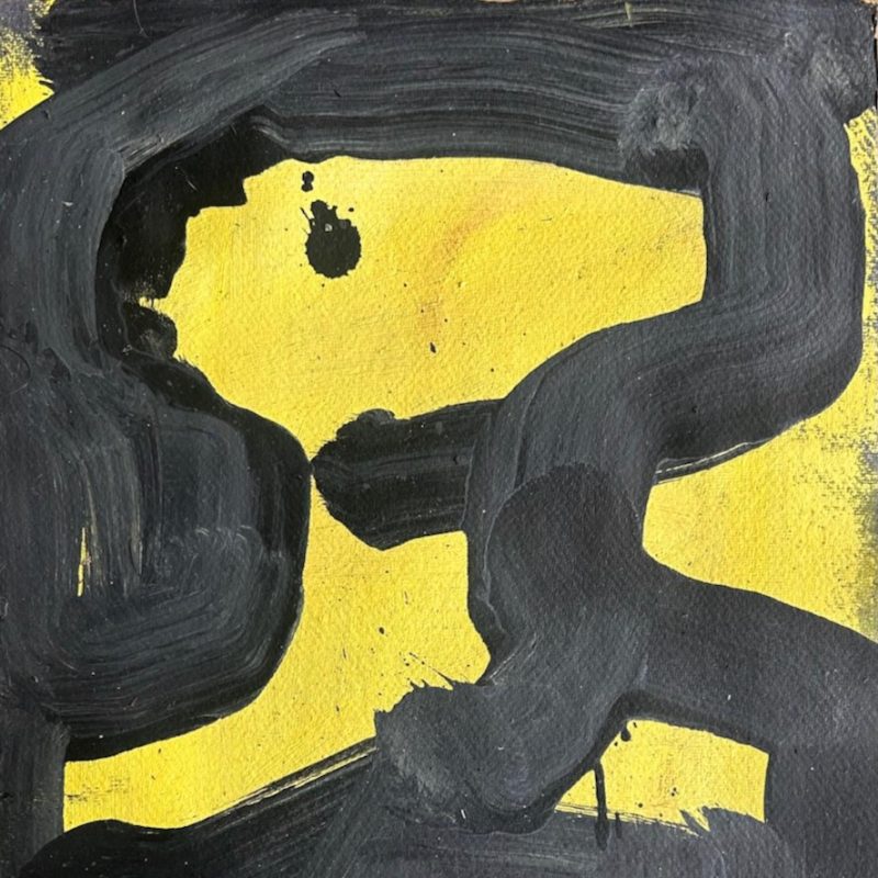 A yellow figure against a dark blue black ground.
