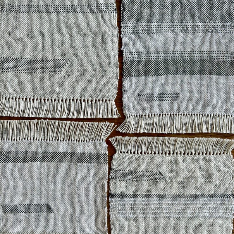 off white square mat with handwoven textile 