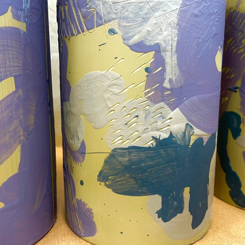 Ceramic vase stoneware and coloured slips forming abstract marks and patterns on the surface.