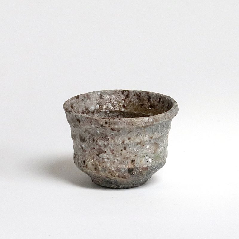 grey small cup with raw clay texture