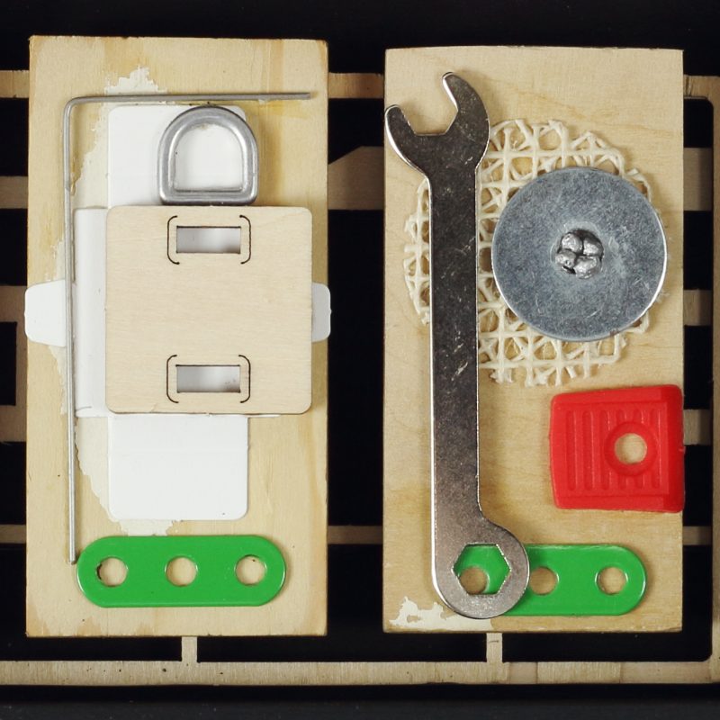 A box of found precious relics from the industrial age in a reclaimed box.