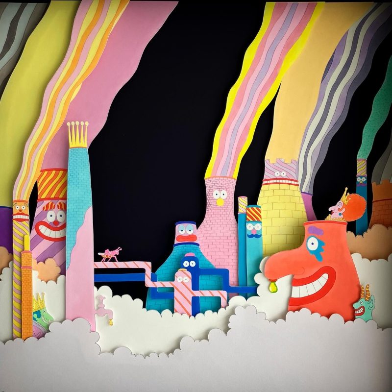 A hand-drawn and colour illustrated diorama featuring cooling towers and chimneys in the clouds, made of layers of Giclée prints mounted in a box frame.