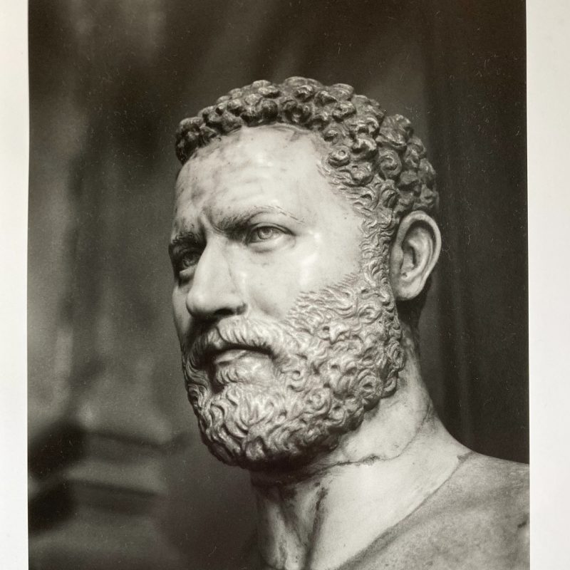 A marble bust of a Victorian lord in a museum.