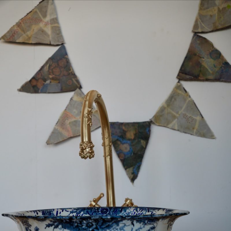 Painted hand wash basin with bunting