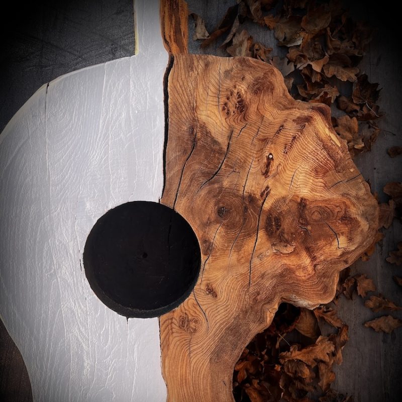 Section of waney edged Elm tree carved and part painted white