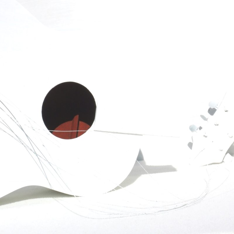 White acoustic guitar, red soundhole, broken strings and headstock