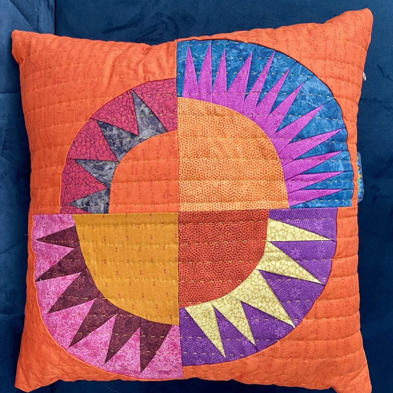 Louise makes a range of beautiful, brightly coloured, quilted cushions
