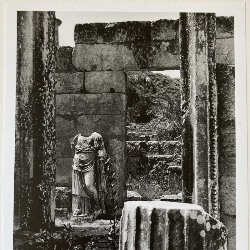A headless statue amongst archeological ruins in Libya.