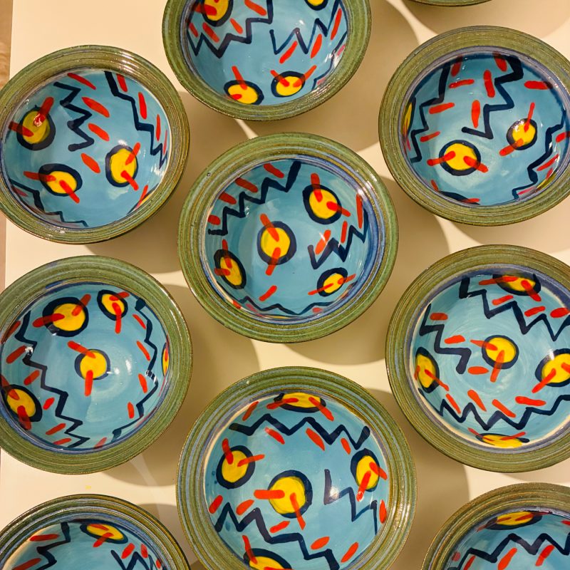Brightly coloured, circular ceramic bowls