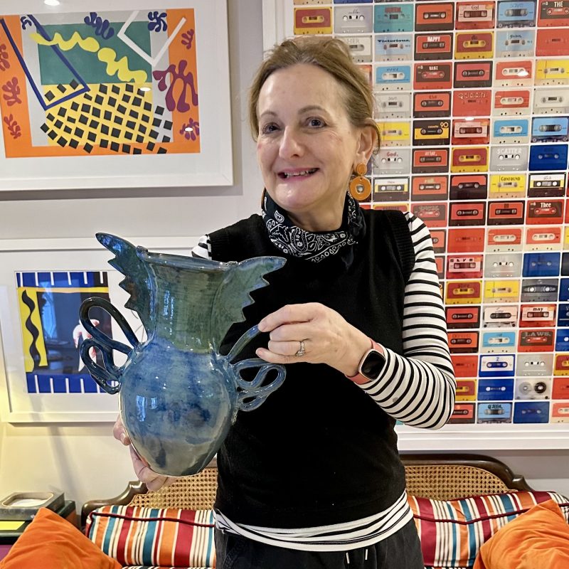 Vaseema Hamilton holding a blue vase
