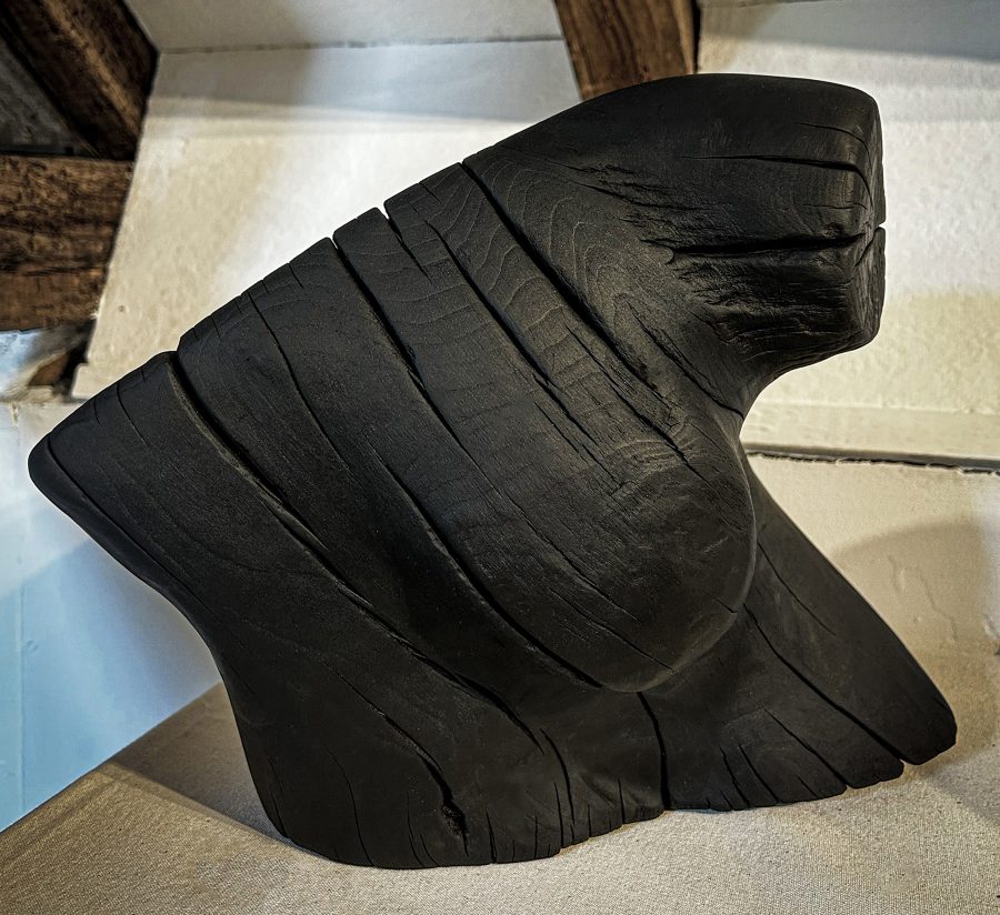 Sculpture of a woman bust in wood