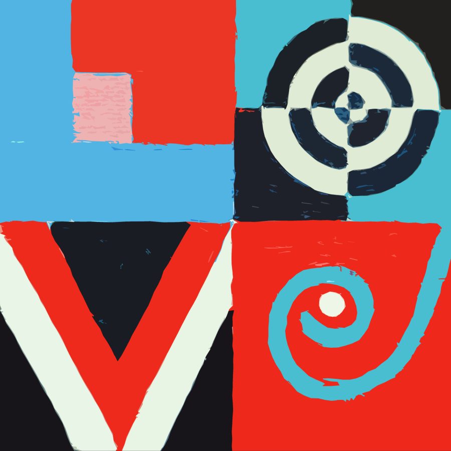 Artist in front of paintings on wall 