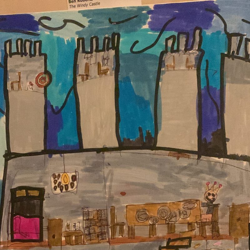 A child’s picture of a man sitting in his castle on a chair up some steps 