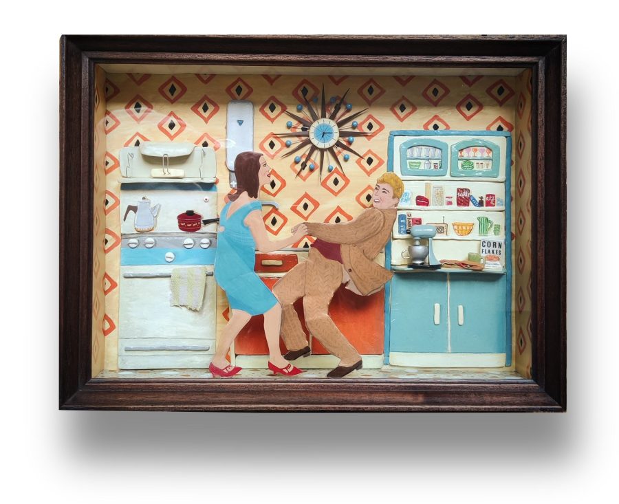 Two 1960's style dancers in a mid century kitchen.