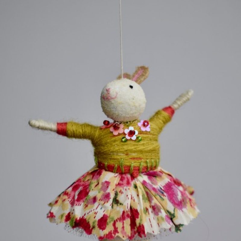 Little bunny wearing a flowery skirt and embroidery details